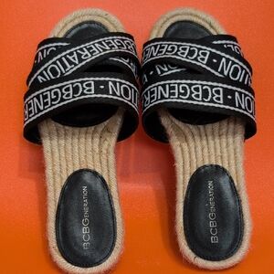 BCBGeneration Black and Tan Logo Slide Sandals